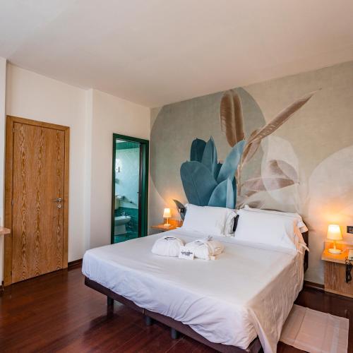 Ένα ή περισσότερα κρεβάτια σε δωμάτιο στο Hotel Logonovo