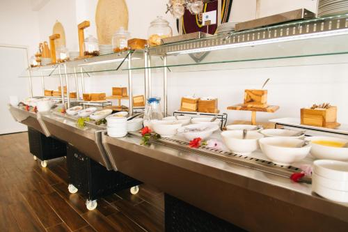 a row of bowls on a counter in a kitchen at Royal Mandarin Hotel & Resort in Pwani Mchangani