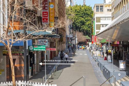 a city street with people walking down the street at MetaWiseBnB Studio Dixon Next to ICC & Darling Harbour 22 in Sydney