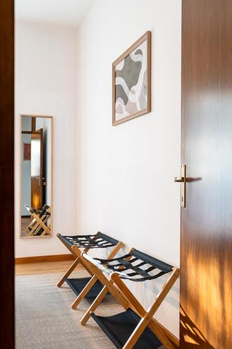 a room with a table and a mirror at Exclusive Villa with Lake view-Private SPA in Galbiate