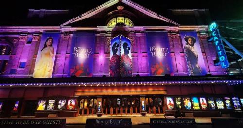 a building with purple lights on the side of it at MetaWiseBnB Studio Dixon Next to ICC & Darling Harbour 58 in Sydney
