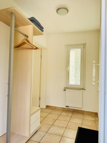 an empty room with a closet and a window at Haases Ferienwohnung in Remscheid