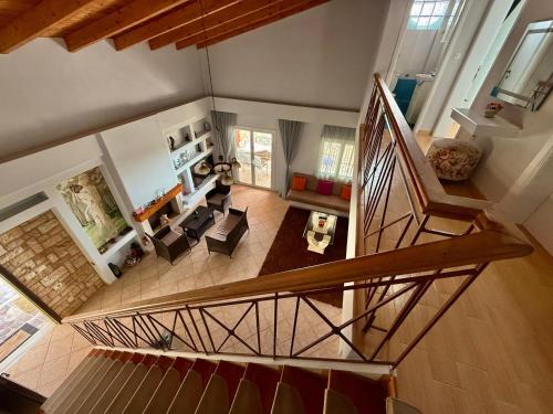 an overhead view of a living room with a staircase at Villa Nefeli in Piqeras