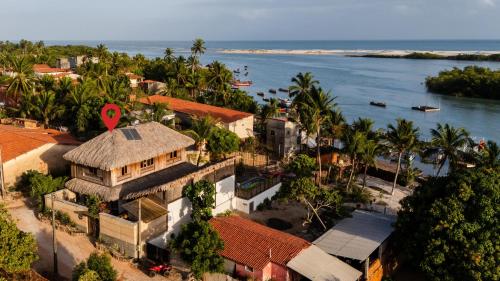 an aerial view of a house next to the ocean at VILLA COLIBRI Guriú in Guriú