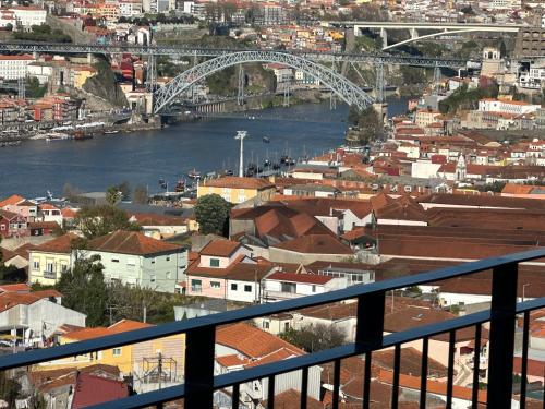 a view of a city with a river and a bridge at New Douro 908 with parking in Vila Nova de Gaia