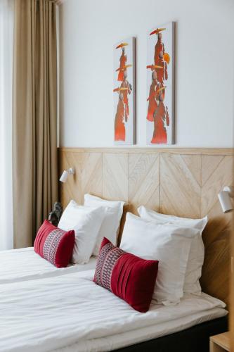 Ένα ή περισσότερα κρεβάτια σε δωμάτιο στο Old Hapsal Hotel