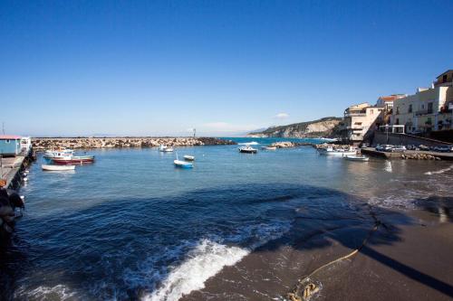 a group of boats in a body of water at Villa Fiorella Art Hotel in Massa Lubrense