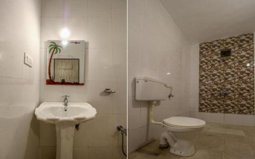 a bathroom with a toilet and a sink at Star Home in Anjuna