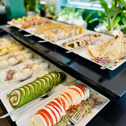 a buffet line with different types of food on plates at Hotel Luxor in Lublin