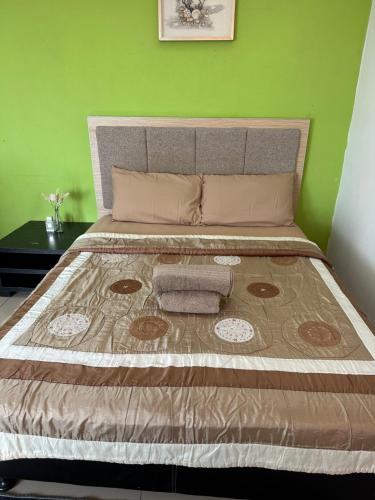Postel nebo postele na pokoji v ubytování De Viana Apartment Homestay