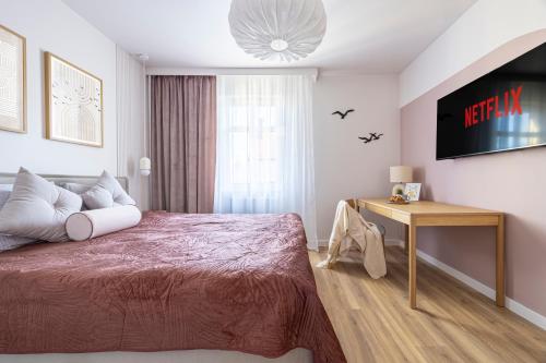 Łóżko lub łóżka w pokoju w obiekcie Comfy Aparts Św Mikołaja