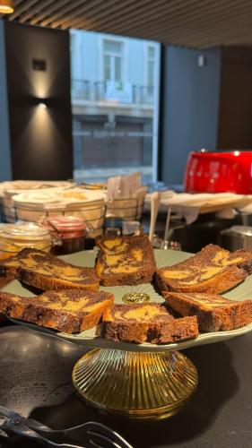a plate of bread and toast on a table at Golden Lisbon Hotel in Lisbon