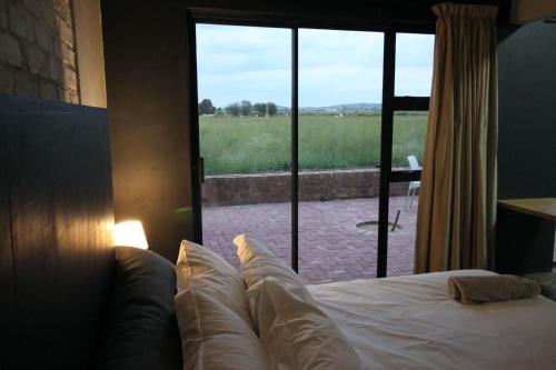 Postel nebo postele na pokoji v ubytování Sunrise Serenity Estate