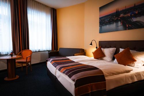 Postel nebo postele na pokoji v ubytování Hotel Boulevard