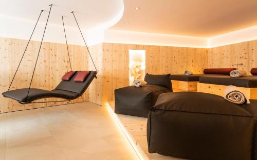 a living room with a couch and a chair at Home's am Hof in Nauders