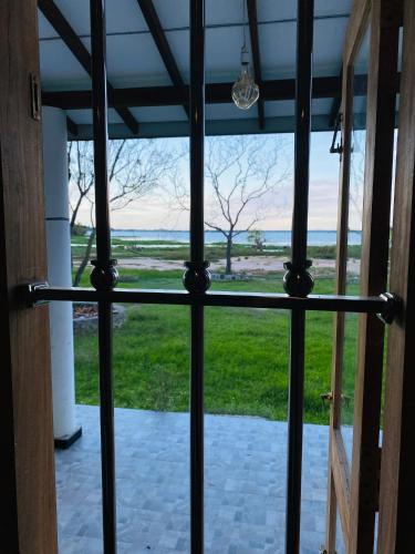 a view from the front door of a house at Lago Inn in Tissamaharama