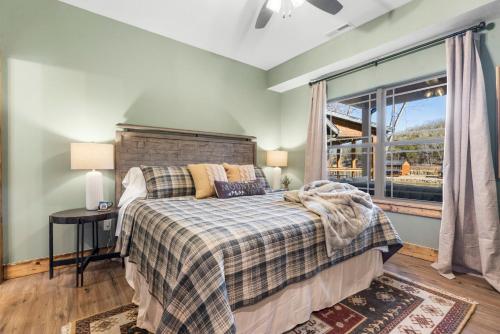 a bedroom with a bed and a window at New Cabin at Tall Timbers! Free Tickets! Indoor and Outdoor Pools! in Hollister