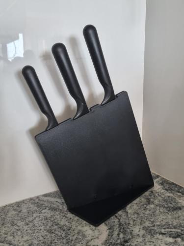 a black holder with two handles on a counter at Newly Furnished Condominium in the Heart of Quezon City near Top Philippine Hospitals in Manila