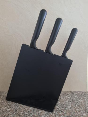 a black holder with three knives in it at Newly Furnished Condominium in the Heart of Quezon City near Top Philippine Hospitals in Manila