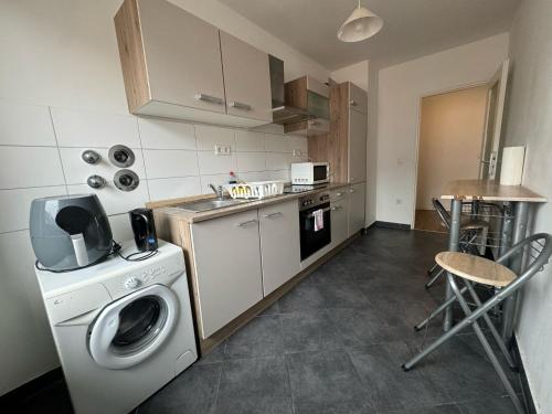 Η κουζίνα ή μικρή κουζίνα στο Juno Apartment