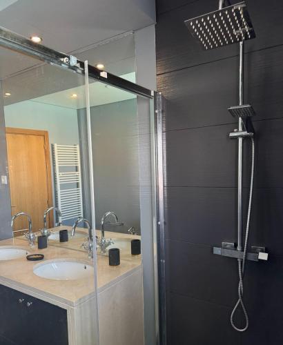 a bathroom with a shower with a sink and a mirror at Spacious quiet charming villa with private pool and close to Lisbon in Monte de Lucas