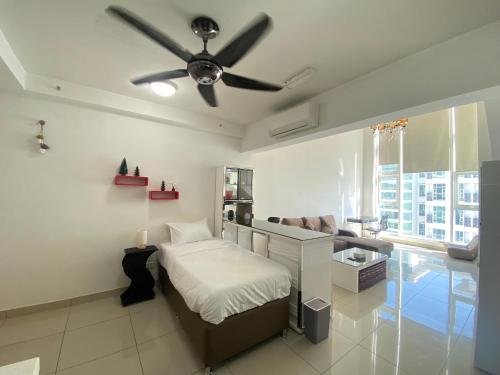 a bedroom with a bed and a ceiling fan at Duplex 775sq ft near Mid Valley in Kuala Lumpur