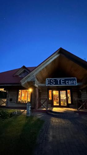 a building with a sign that reads es i caffe at Jaunsētas in Alūksne
