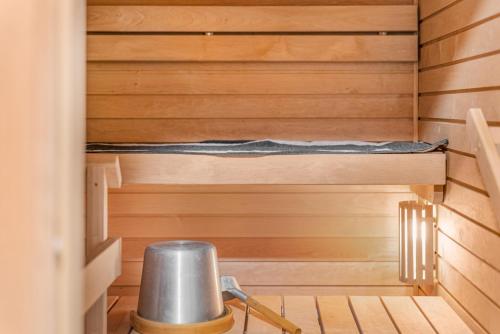 a sauna with a bench in the middle at Come in! "Ilmatar" Luxury apartments in the heart of Tampere with yacuzzi option! in Tampere