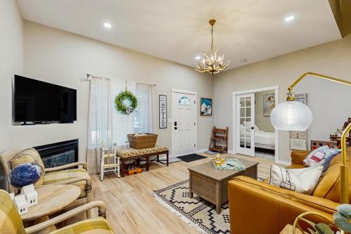 a living room filled with furniture and a tv at Lupine Chalet in Rhododendron