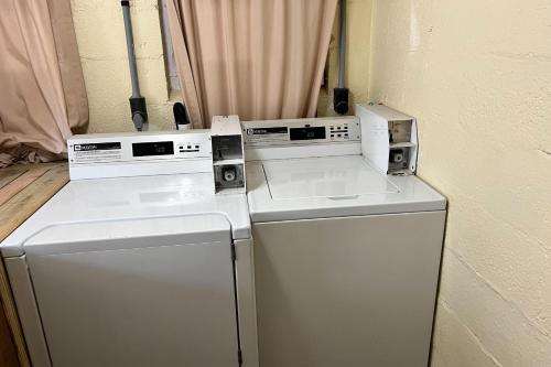 two washing machines are sitting next to each other at Georgianne Suite Two in Tybee Island