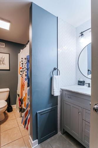 a bathroom with a sink and a mirror at North Central Loft in Staunton