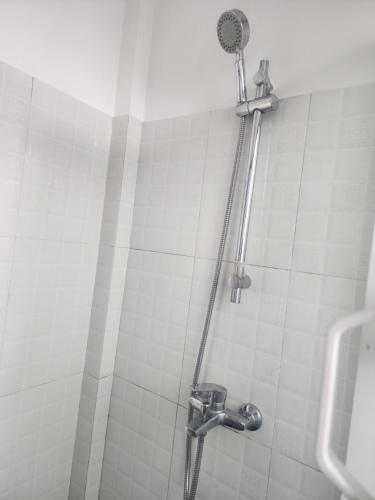 a shower stall in a bathroom with a shower at Span Grand @ Nuwara Eliya in Nuwara Eliya