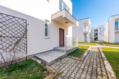 a house with a gate in front of it at Coastal Haven Talea in Tale