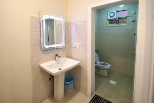 a bathroom with a sink and a toilet at شقق المصيف للشقق المخدومة in Abha