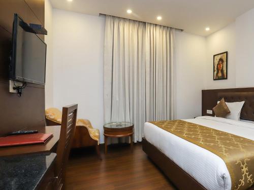 Una cama o camas en una habitación de Hotel JMD