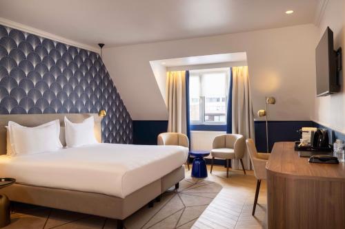 Postel nebo postele na pokoji v ubytování Hotel The Augustin