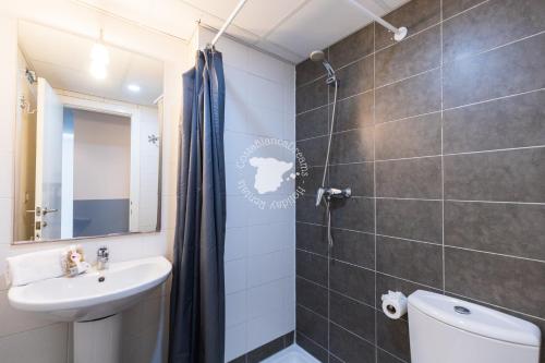 a bathroom with a sink and a toilet and a shower at Apartment El Sol in Moraira