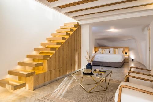 Postel nebo postele na pokoji v ubytování Rocabella Santorini Hotel & Spa