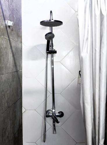a bathroom with a shower with a stand up shower at Mouse House in Chişinău