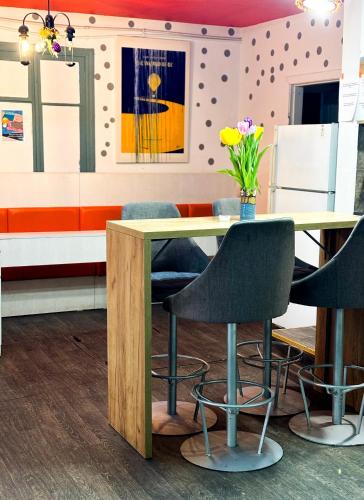 a dining room with a table and chairs at Mouse House in Chişinău
