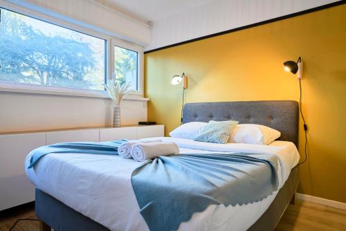 En eller flere senge i et værelse på Studio tout confort