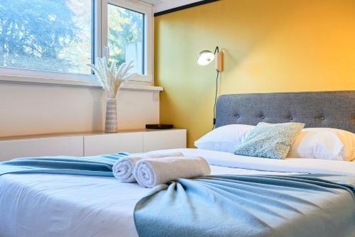 En eller flere senge i et værelse på Studio tout confort