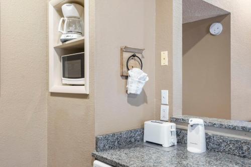 a room with a counter with a microwave and a mirror at Evergreen Ridge 27 in Kimberling City