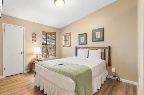 a bedroom with a large bed and a window at Evergreen Ridge 27 in Kimberling City