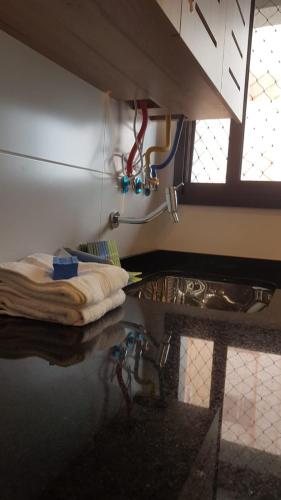 a room with a sink and a counter with water at Gerizim in Vila Velha