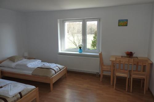 Postel nebo postele na pokoji v ubytování Pokoje Gościnne Pod Brzózką