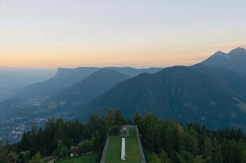 a road on top of a mountain with mountains at Vigilius Mountain Resort in Lana