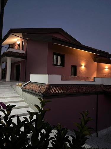 a house at night with the lights on at Villa Cocomerara Tas24 in Calimera