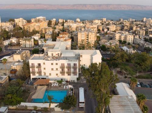 an aerial view of a city and the ocean at Astoria Galilee Hotel in Tiberias