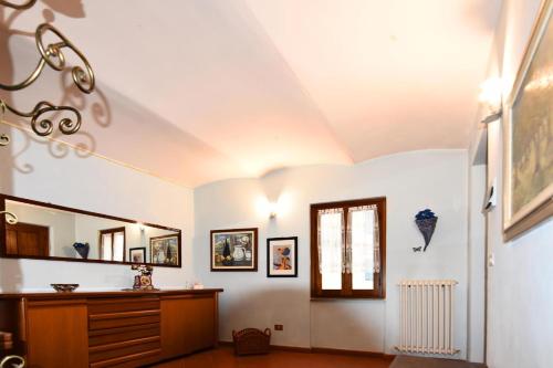 a bathroom with a vanity and a mirror at Appartamento Vetta Cremolino in Cremolino
